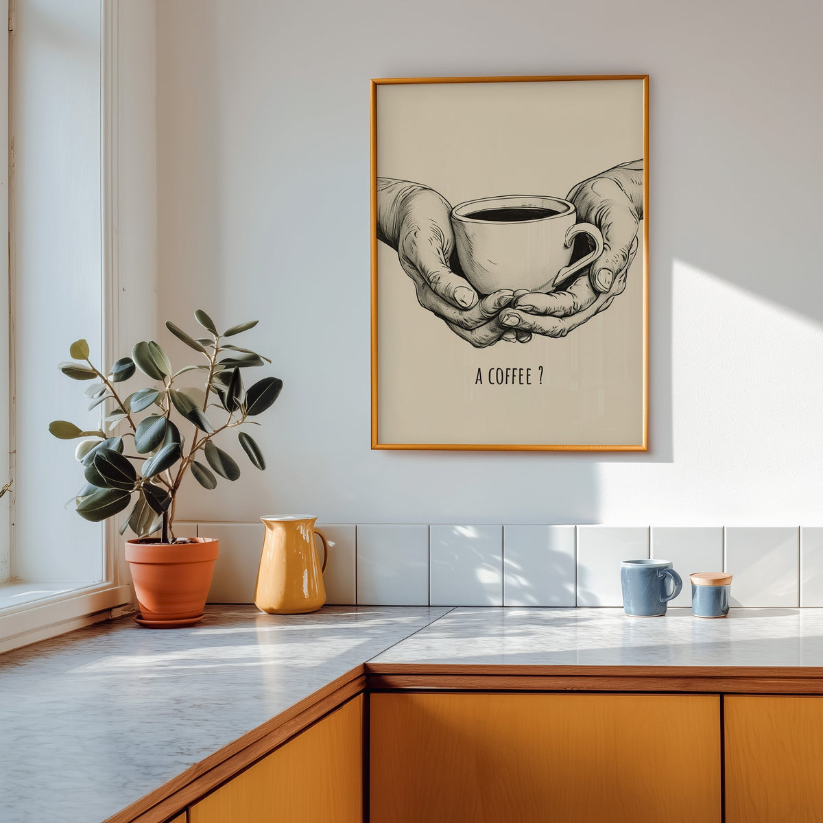 A Coffee sketch print shown in a gold frame above a marble counter in a tan kitchen