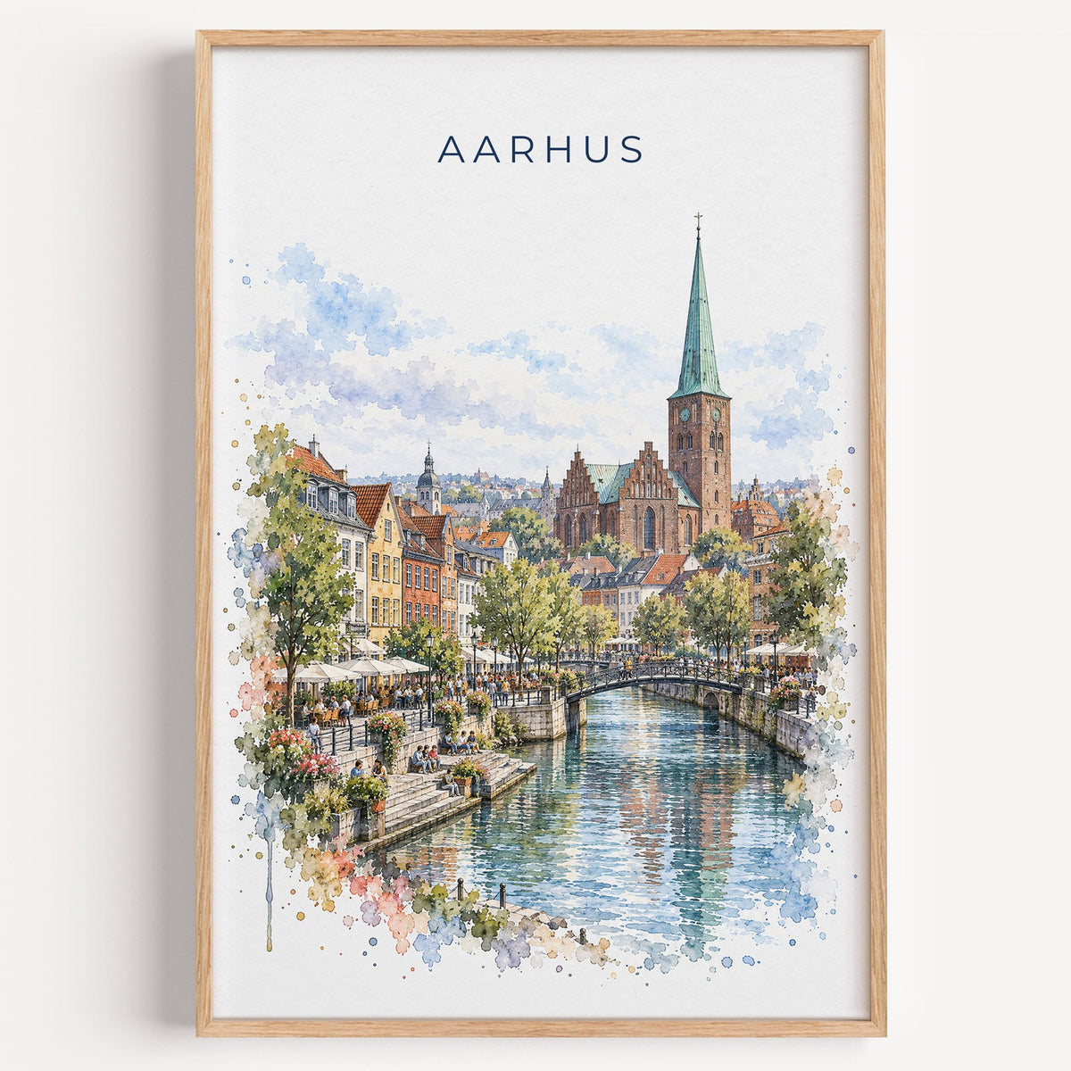 Aarhus watercolor print in a light oak frame on a plain white wall