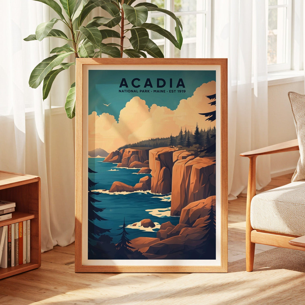 Acadia National Park print in an oak frame by a sunlit window with sheer curtains and a fig plant