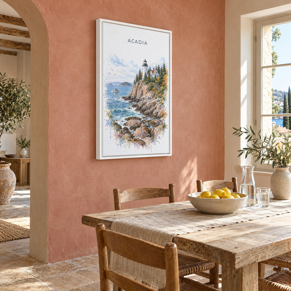 Acadia National Park watercolor print as a white floater canvas on a terracotta wall above a rustic dining table