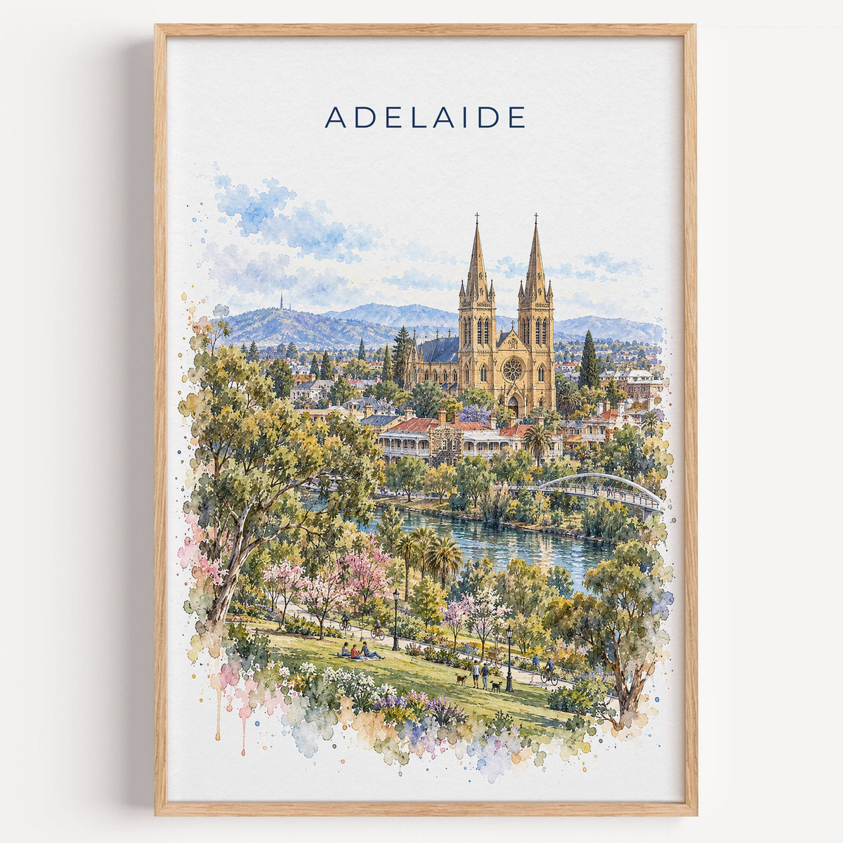 Adelaide watercolor print in a light oak frame on a plain white wall