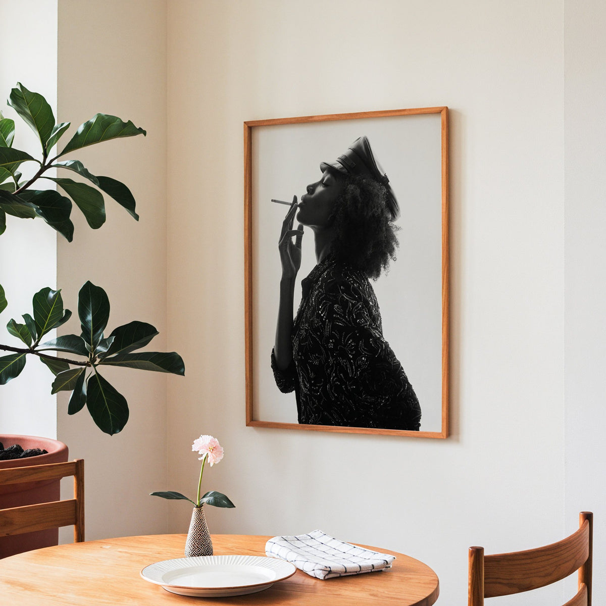 Backlit profile in leather cap with curly hair print in a teak frame above a round wooden dining table