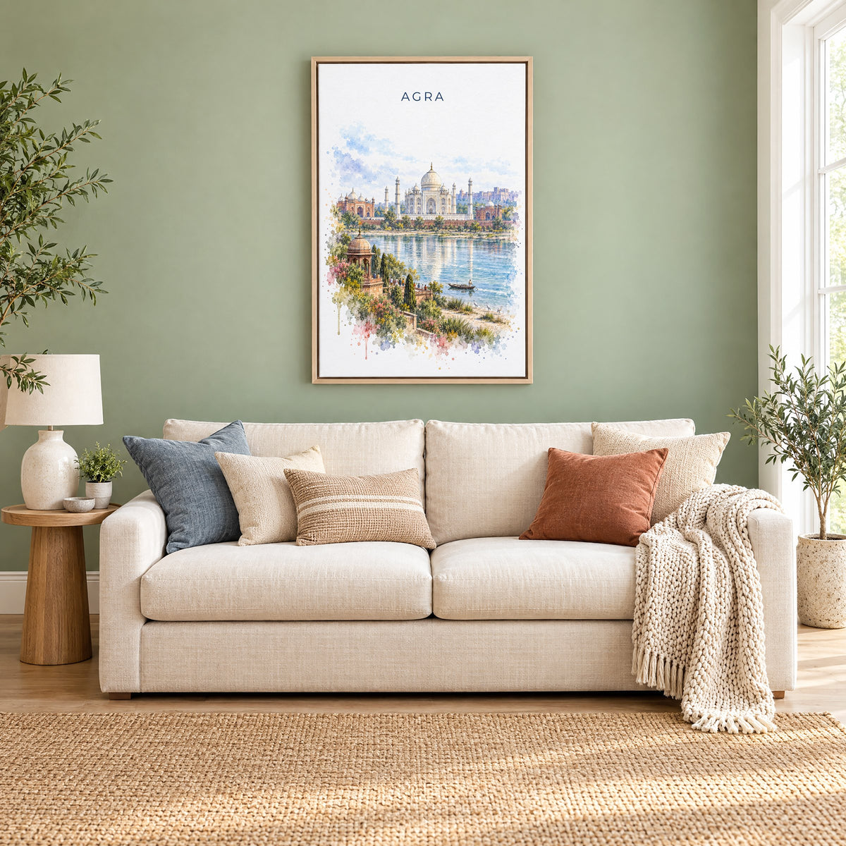 Agra watercolor print as a natural floater canvas above a cream linen sofa on a sage green wall