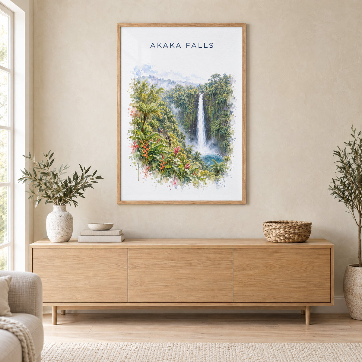 Akaka Falls watercolor print in an oak frame above a light wood sideboard in a Scandinavian living room