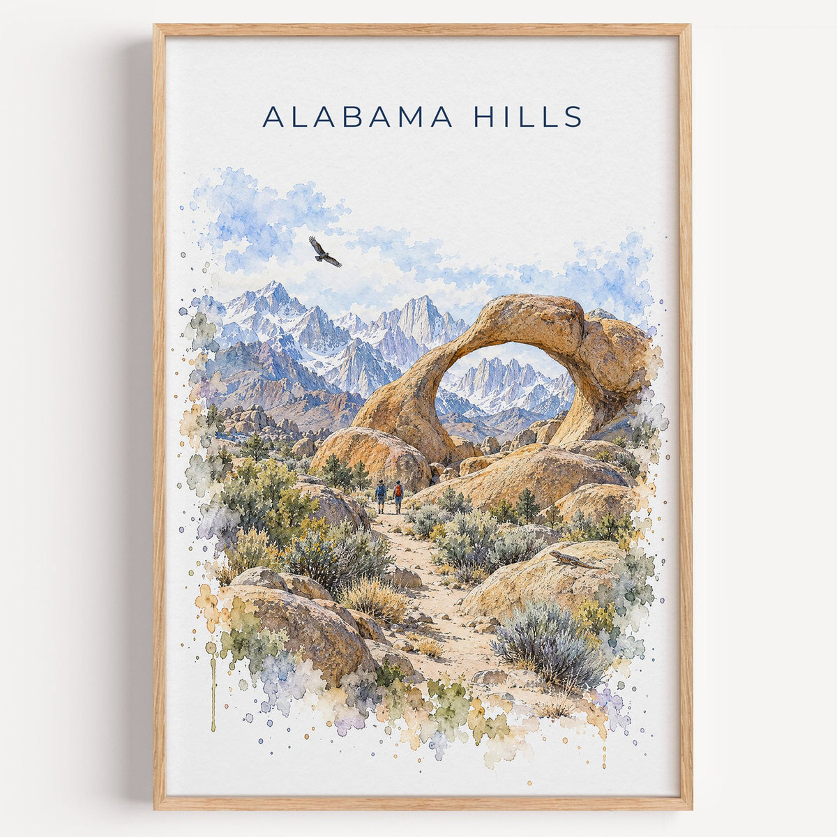 Alabama Hills watercolor print in a light oak frame on a plain white wall