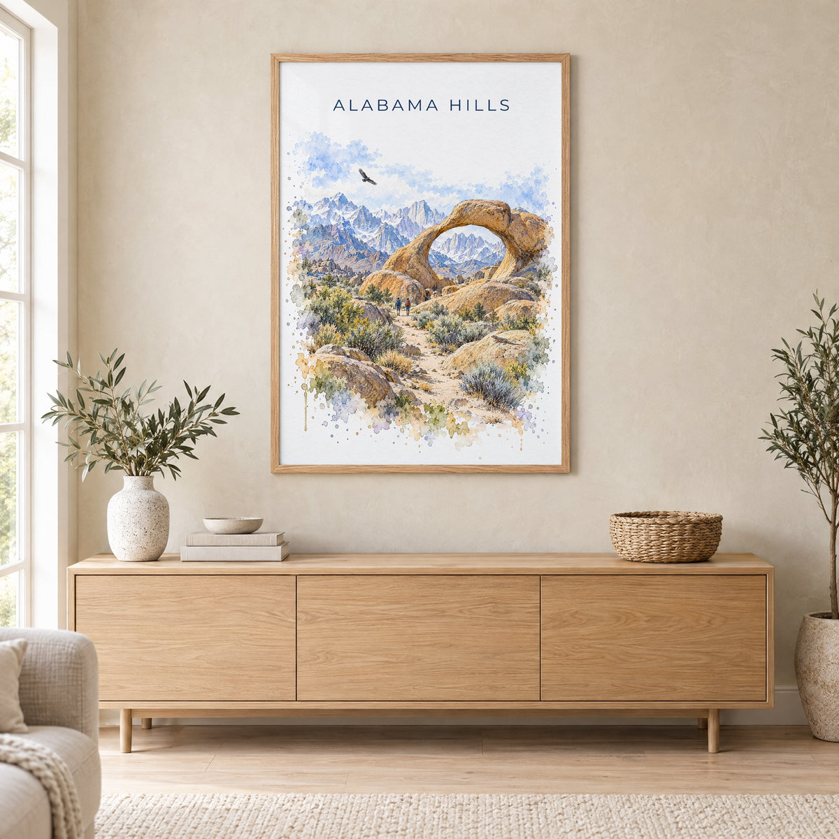 Alabama Hills watercolor print in an oak frame above a light wood sideboard in a Scandinavian living room