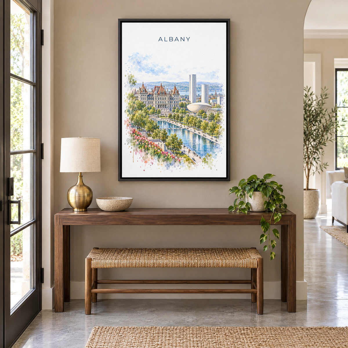 Albany, New York watercolor print as a black floater canvas above a walnut console and woven bench in an entryway