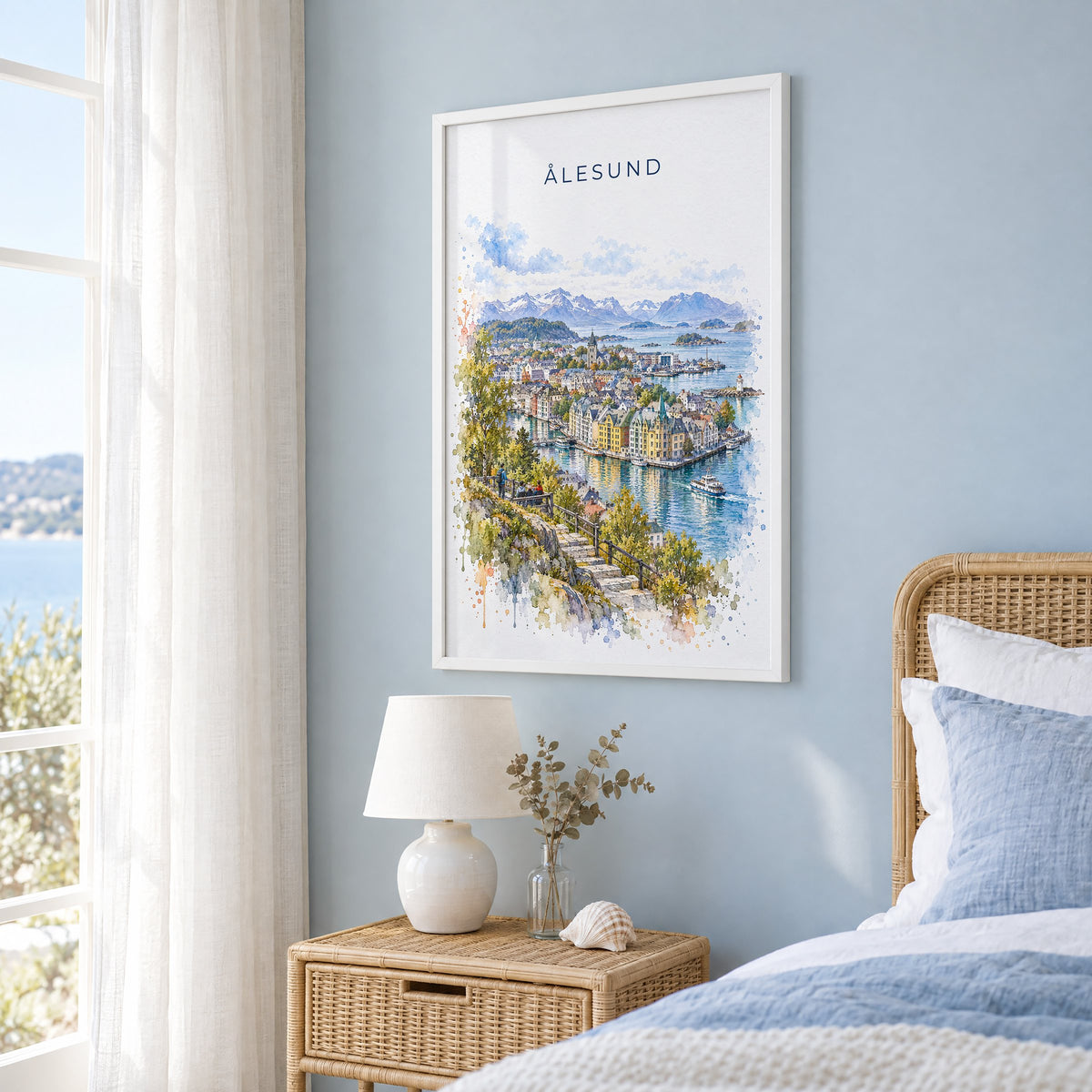 Ålesund watercolor print in a white frame on a pale blue wall beside a rattan bed in a coastal bedroom