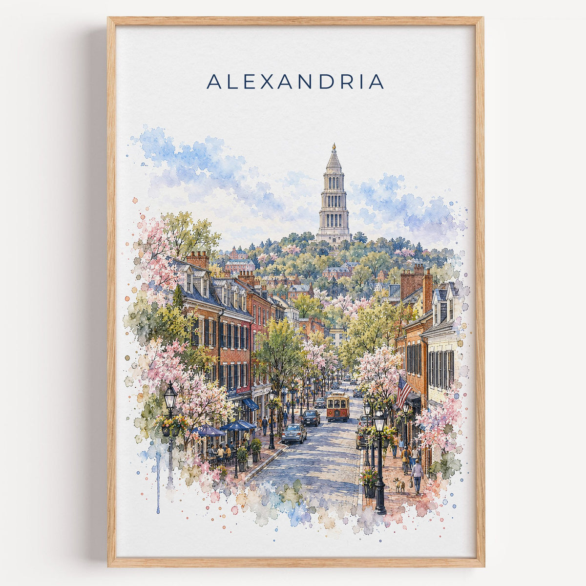 Alexandria watercolor print in a light oak frame on a plain white wall