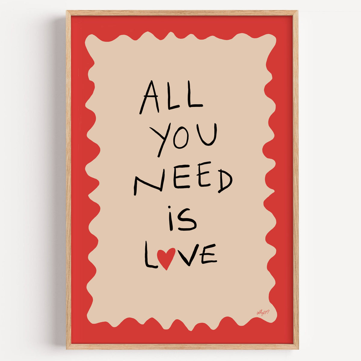 All you need is love heart nursery print in a light oak frame on a plain white wall