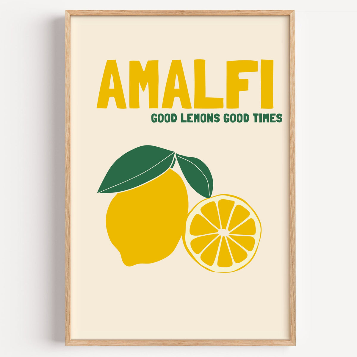 Amalfi good lemons good times print in a light oak frame on a plain white wall