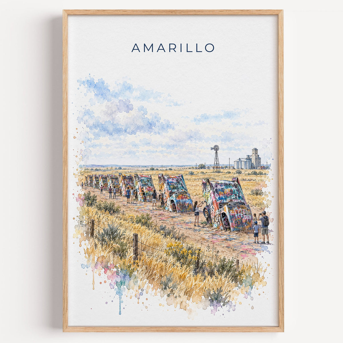 Amarillo watercolor print in a light oak frame on a plain white wall