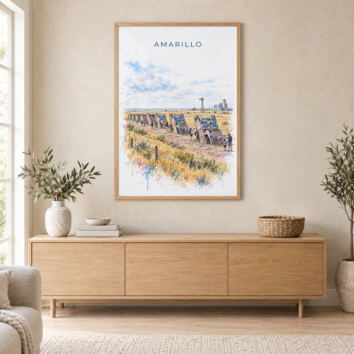 Amarillo watercolor print in an oak frame above a light wood sideboard in a Scandinavian living room
