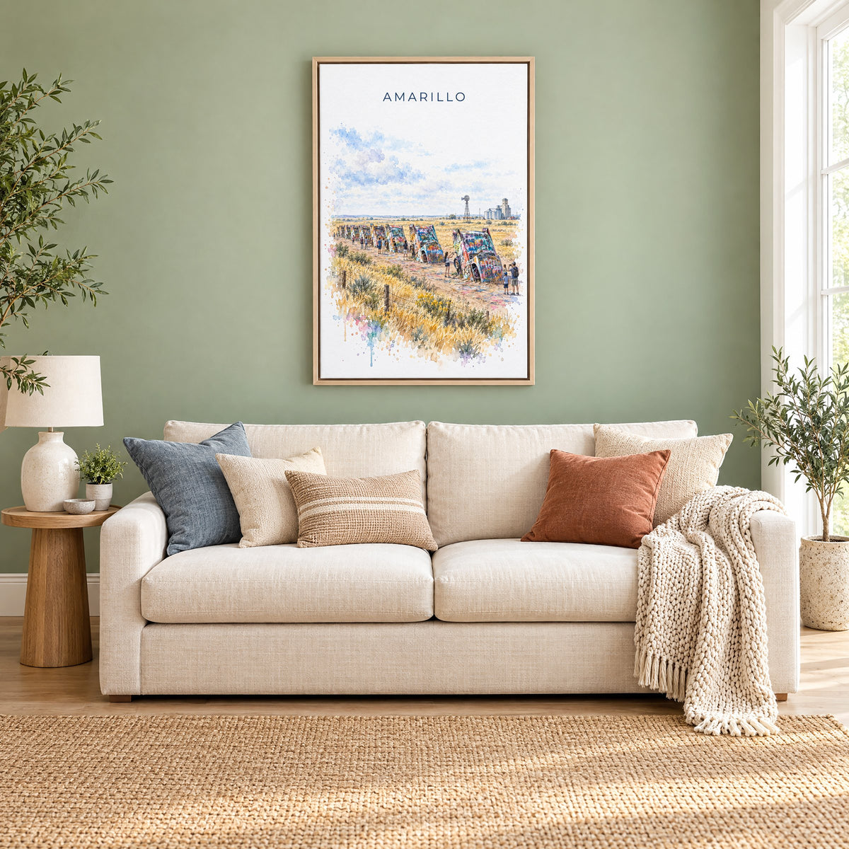 Amarillo watercolor print as a natural floater canvas above a cream linen sofa on a sage green wall