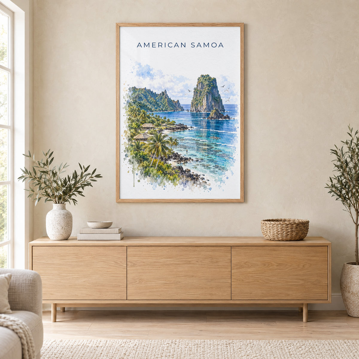 American Samoa National Park watercolor print in an oak frame above a light wood sideboard in a Scandinavian living room
