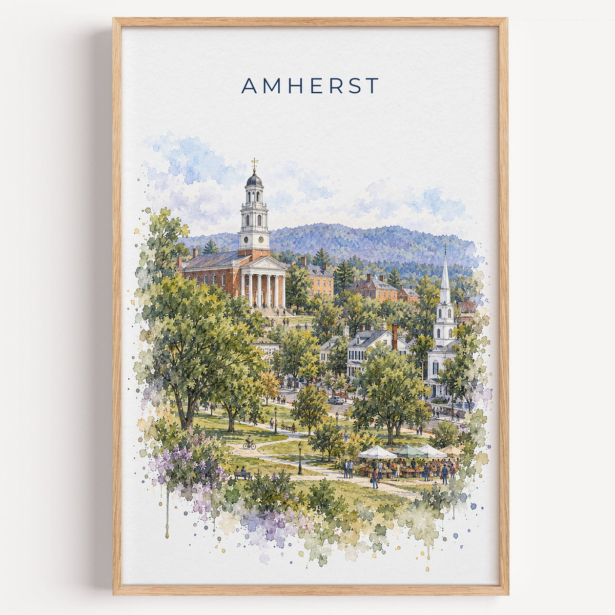 Amherst, Massachusetts watercolor print in a light oak frame on a plain white wall