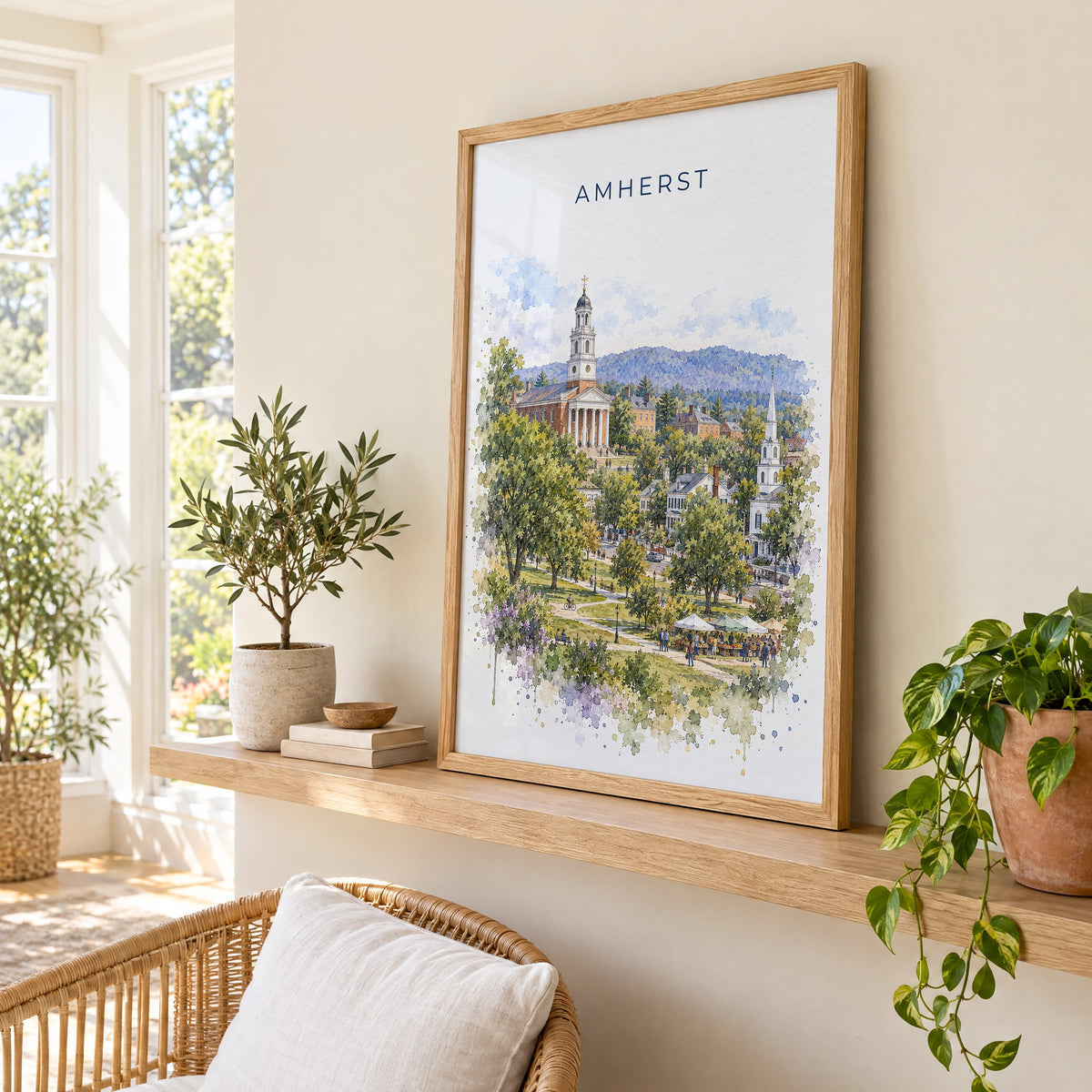 Amherst, Massachusetts watercolor print in an oak frame on a picture ledge in a sunlit sunroom