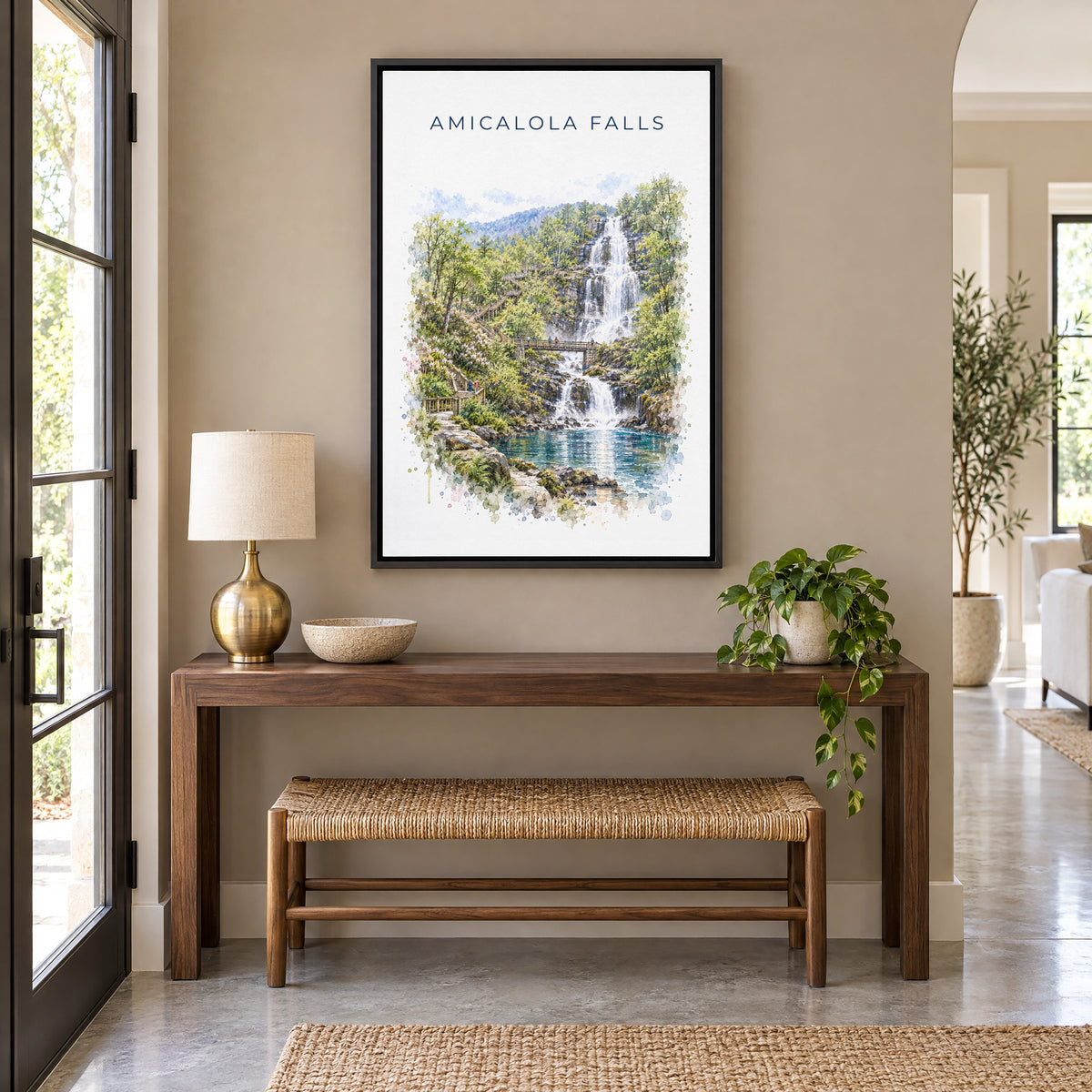 Amicalola Falls State Park watercolor print as a black floater canvas above a walnut console and woven bench in an entryway