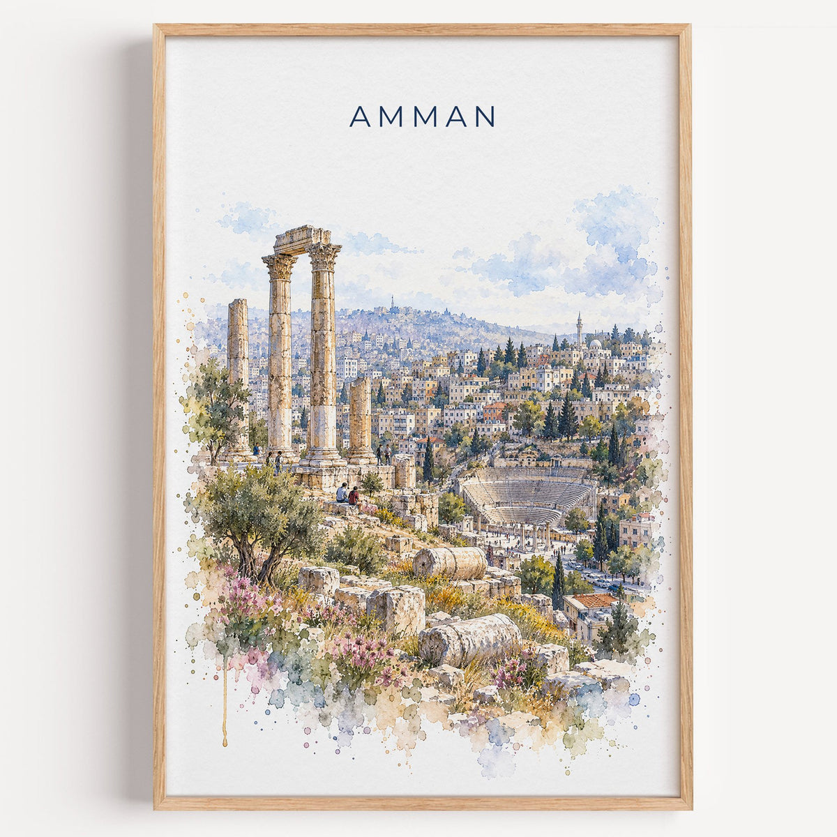 Amman watercolor print in a light oak frame on a plain white wall