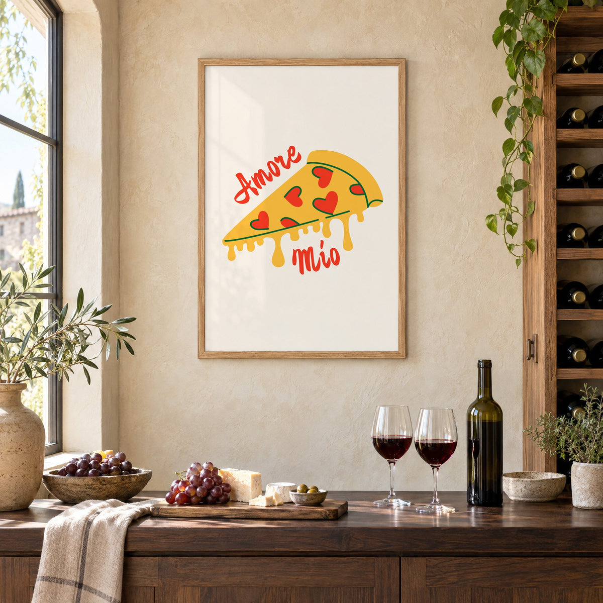 Amore Mio heart pizza slice print in an oak frame on a limewashed wall above a wine counter with red wine, cheese and grapes