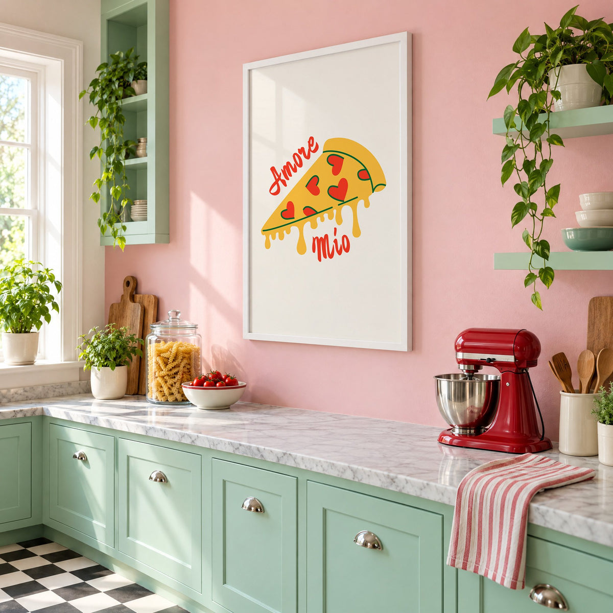 Amore Mio heart pizza slice print in a white frame on a pink wall above mint green cabinets in a retro kitchen, seen at an angle