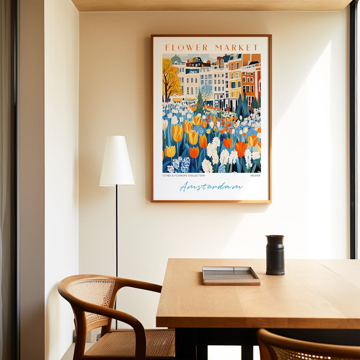 Amsterdam flower market print in an oak frame above a dining table and cane chair