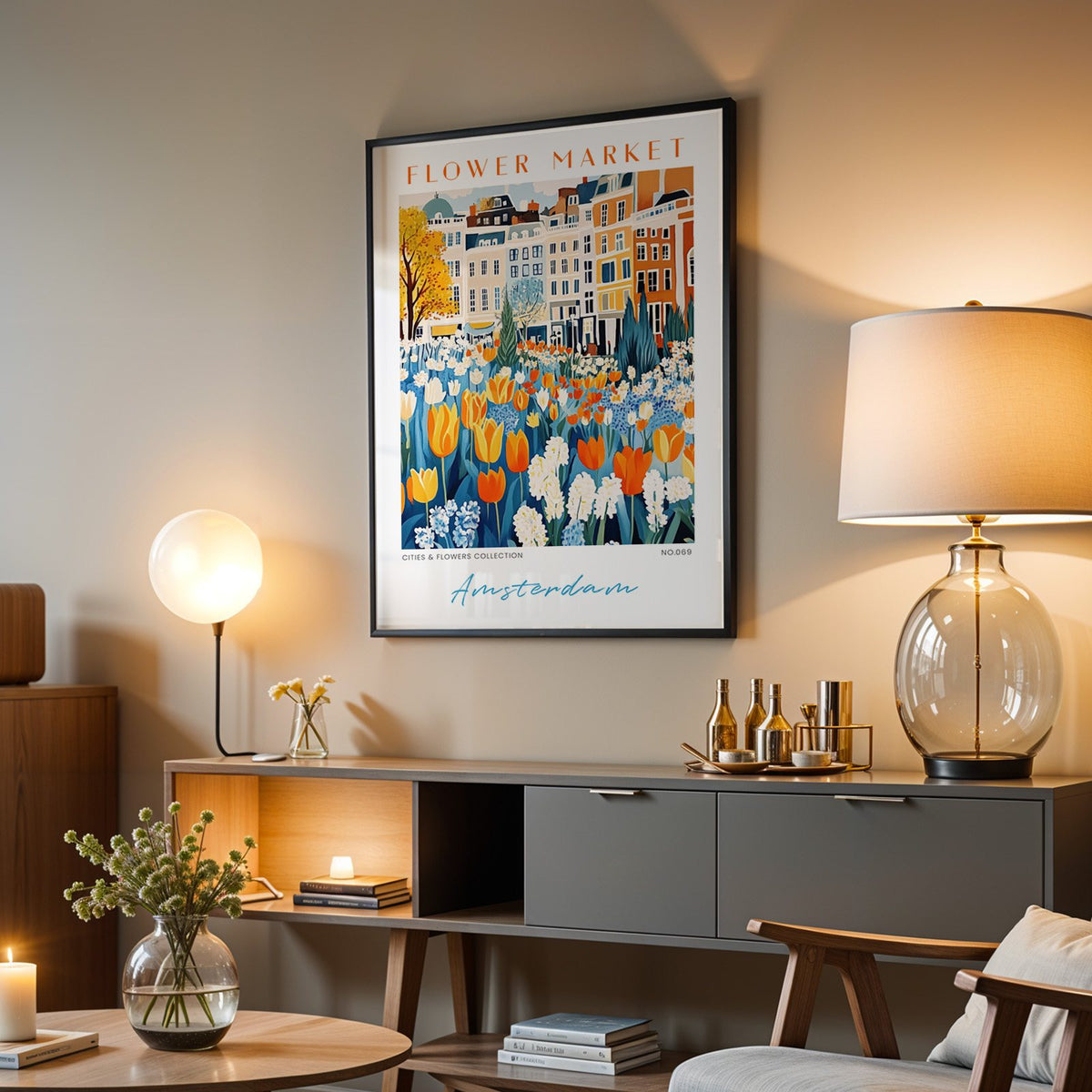 Amsterdam flower market print in a black frame above a grey media console with a glass table lamp