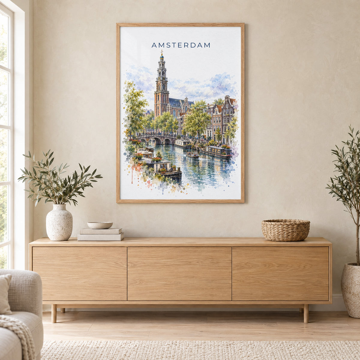 Amsterdam watercolor print in an oak frame above a light wood sideboard in a Scandinavian living room
