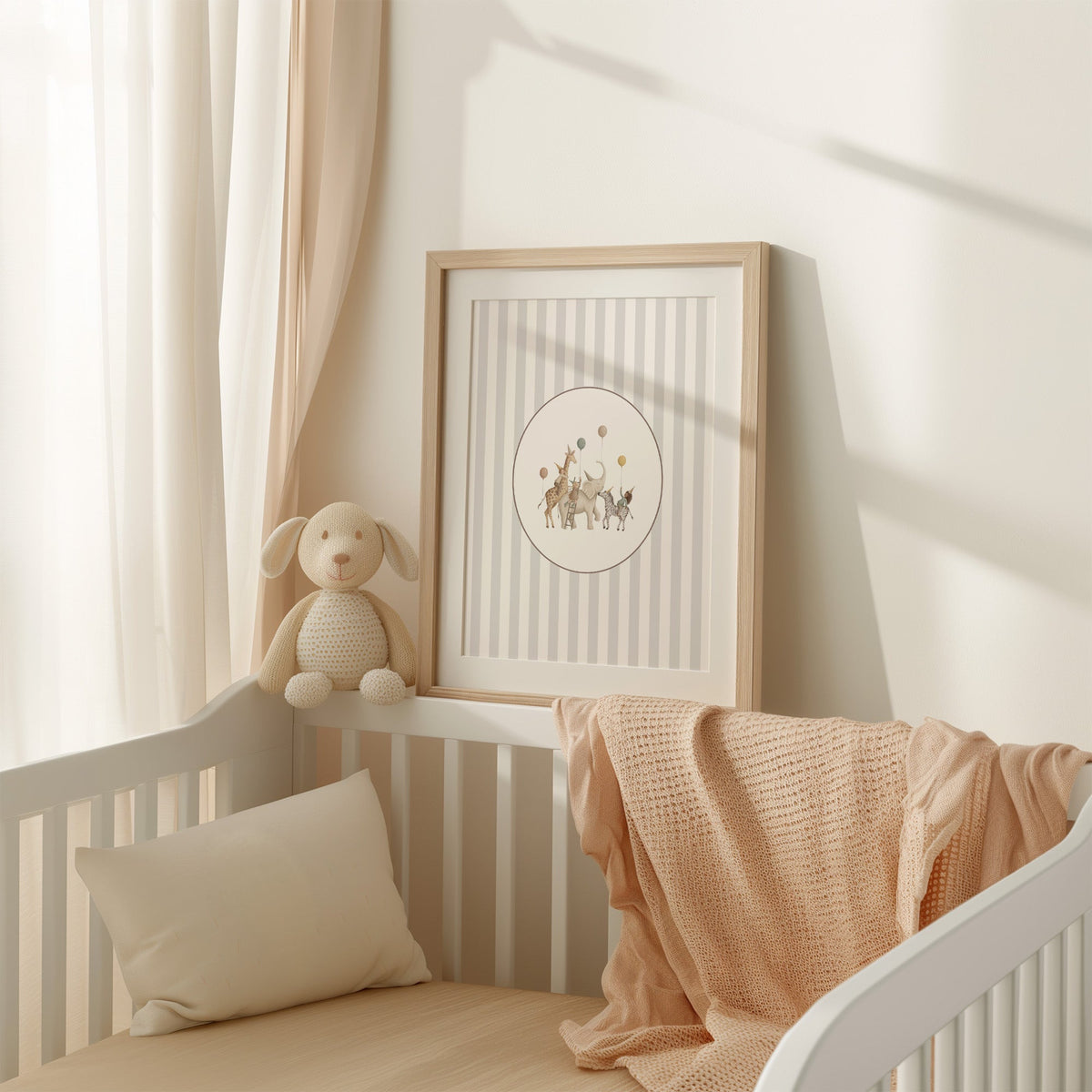 Animal birthday parade in an oval on stripes nursery print shown in an oak frame with a white mat on a crib rail