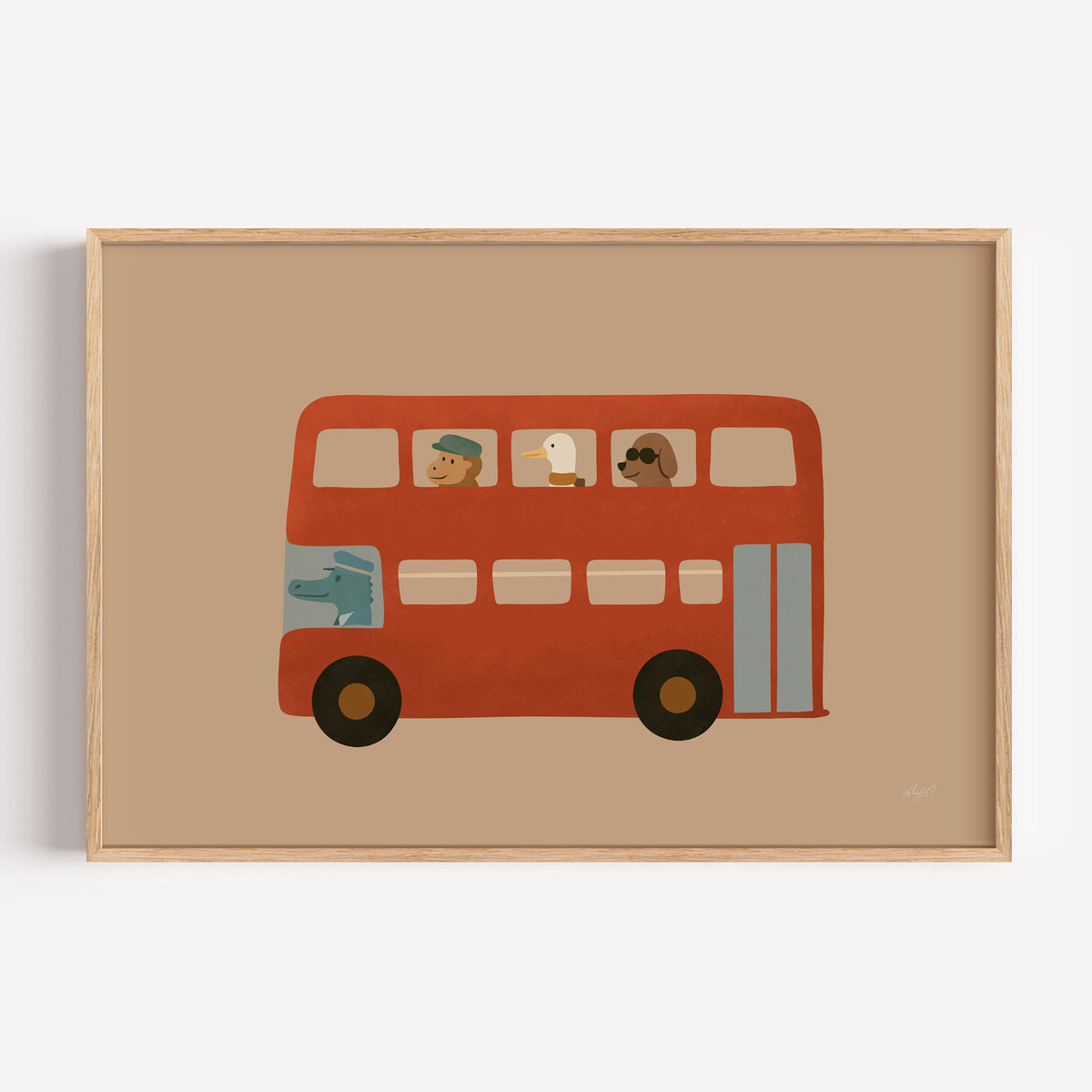Animals riding red double decker bus nursery print in a light oak frame on a plain white wall