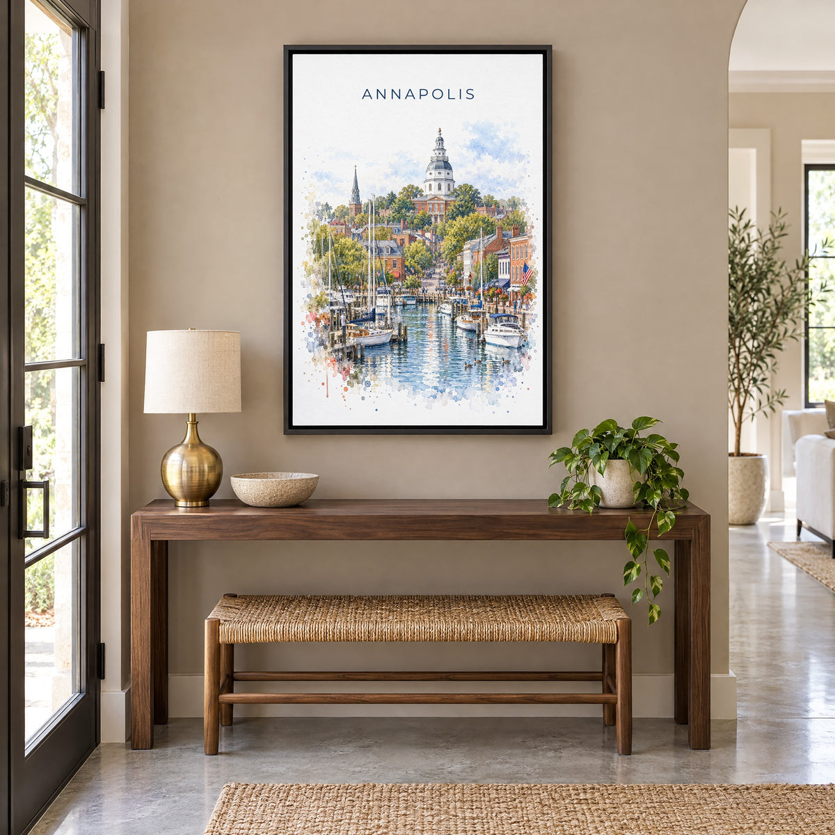Annapolis watercolor print as a black floater canvas above a walnut console and woven bench in an entryway