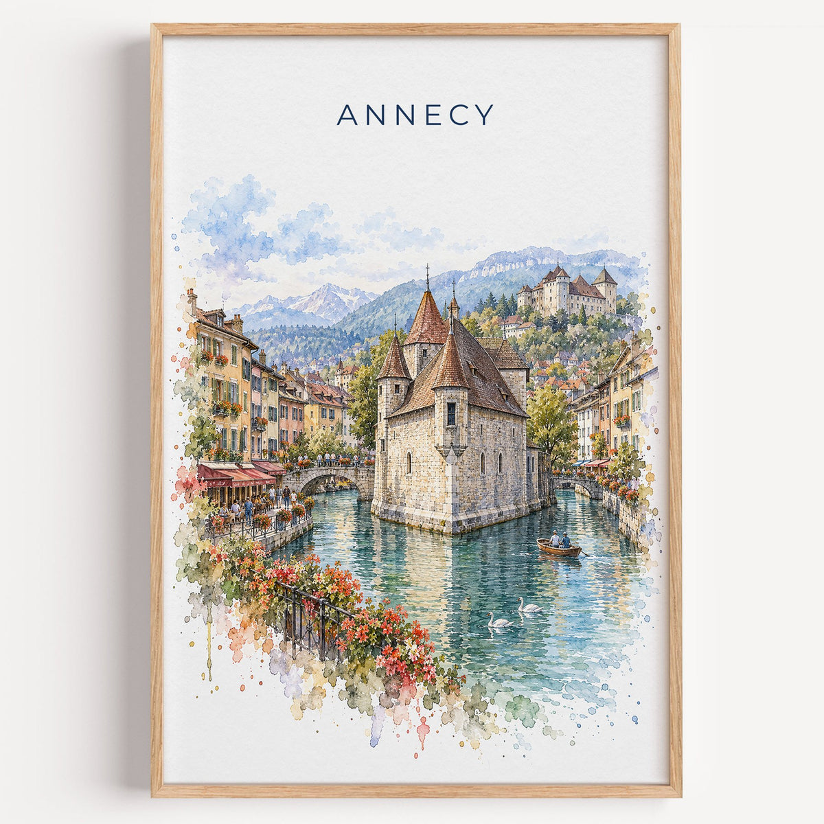 Annecy watercolor print in a light oak frame on a plain white wall