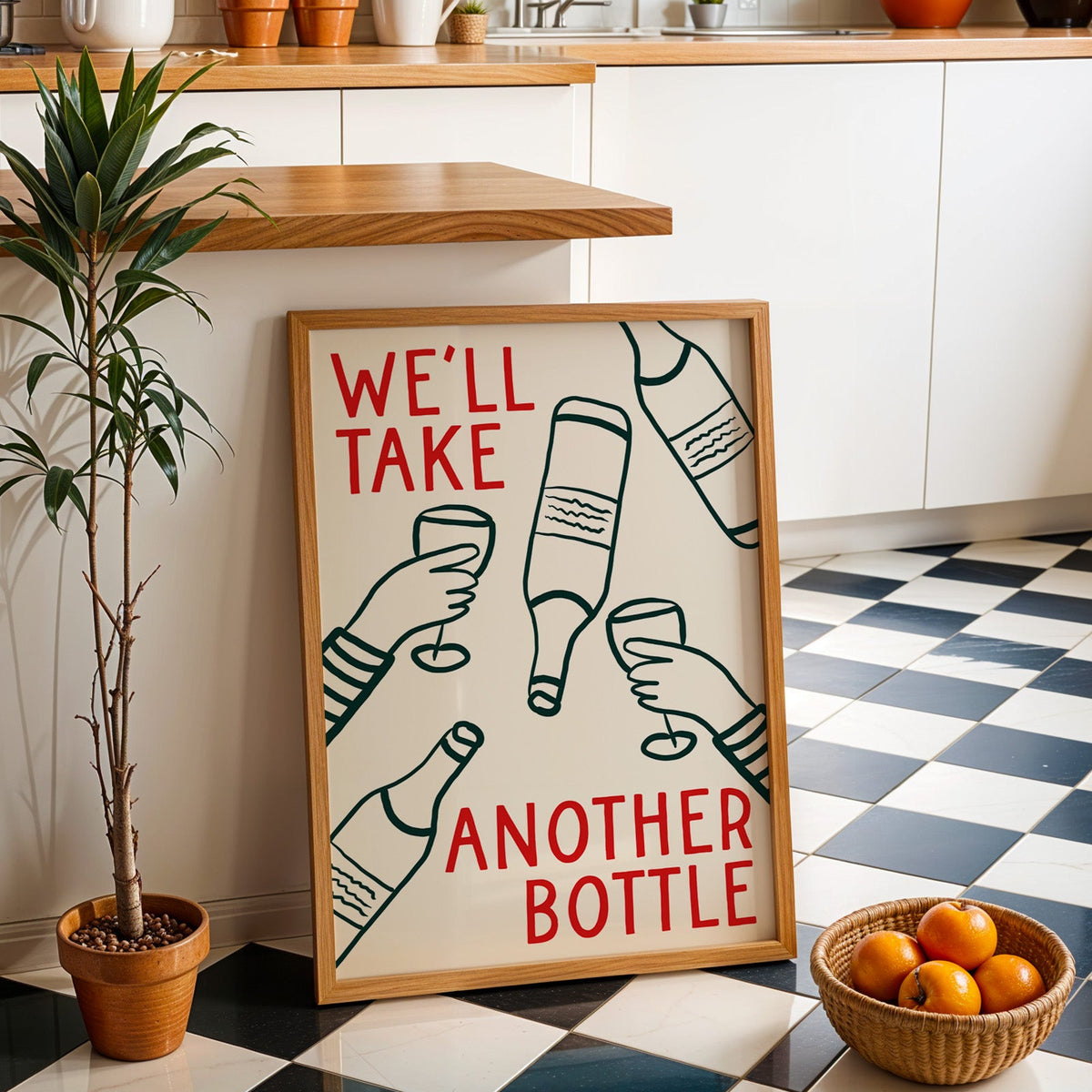 We'll Take Another Bottle wine print in an oak frame by a kitchen island and checkered floor
