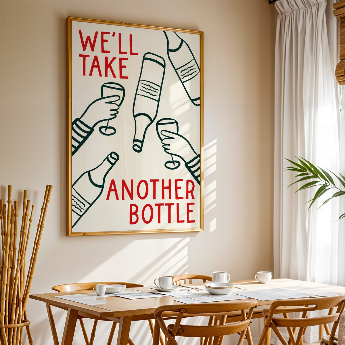 We'll Take Another Bottle wine print in a gold frame above a sunlit breakfast table