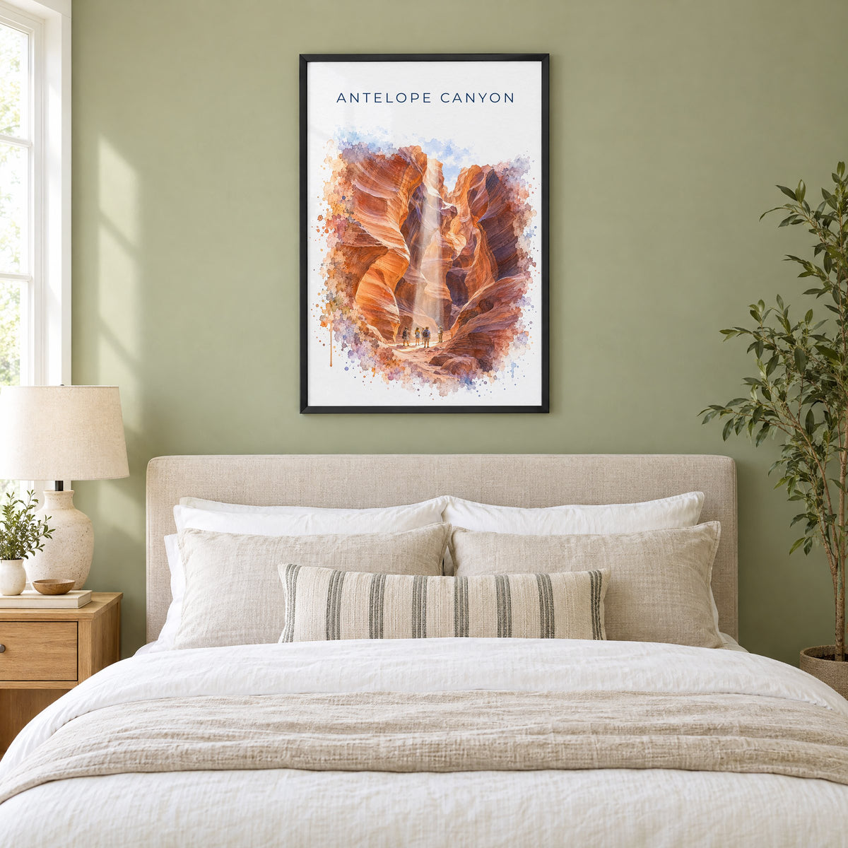 Antelope Canyon watercolor print in a black frame above an upholstered headboard in a sage green bedroom