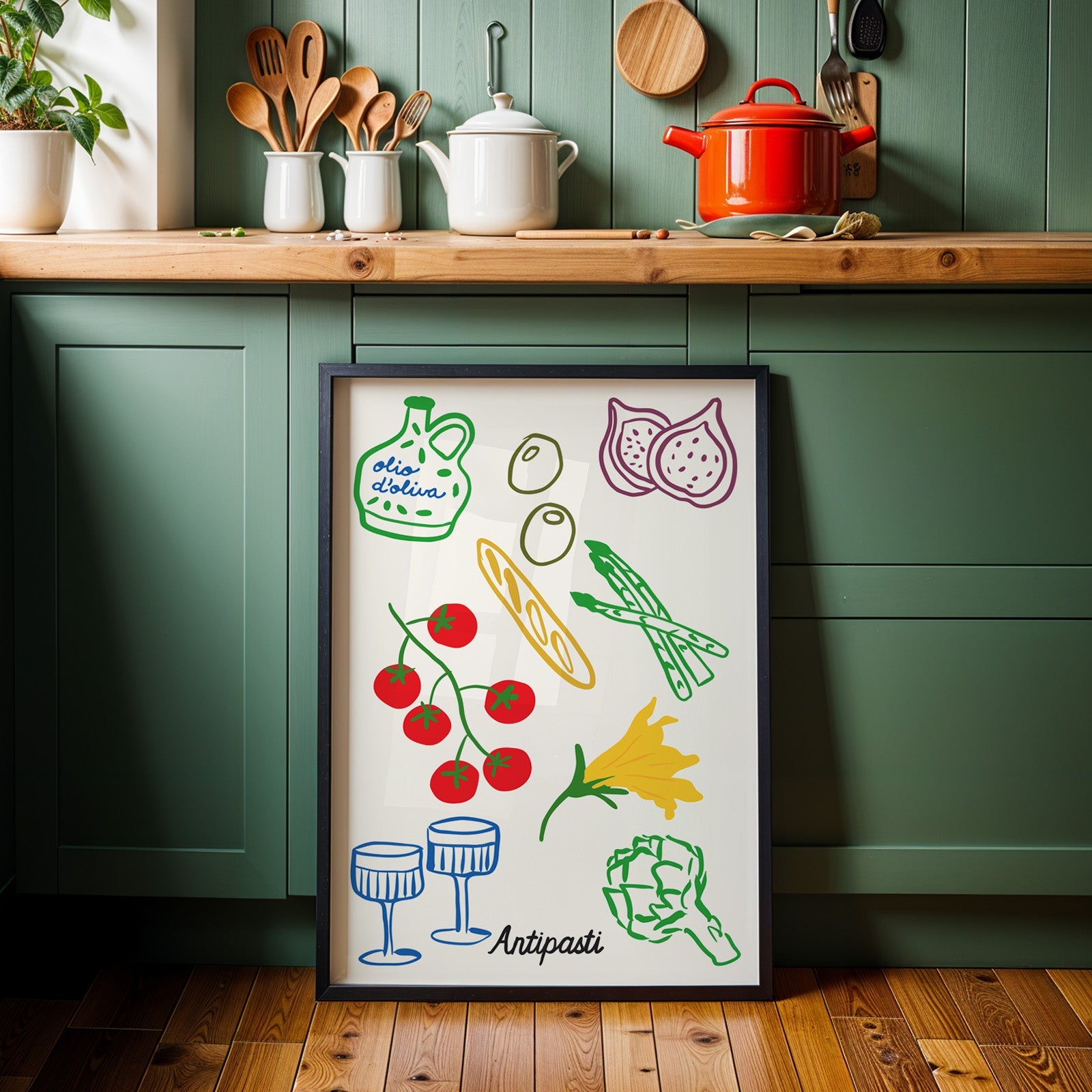 Antipasti line art print in a black frame against sage green kitchen cabinets