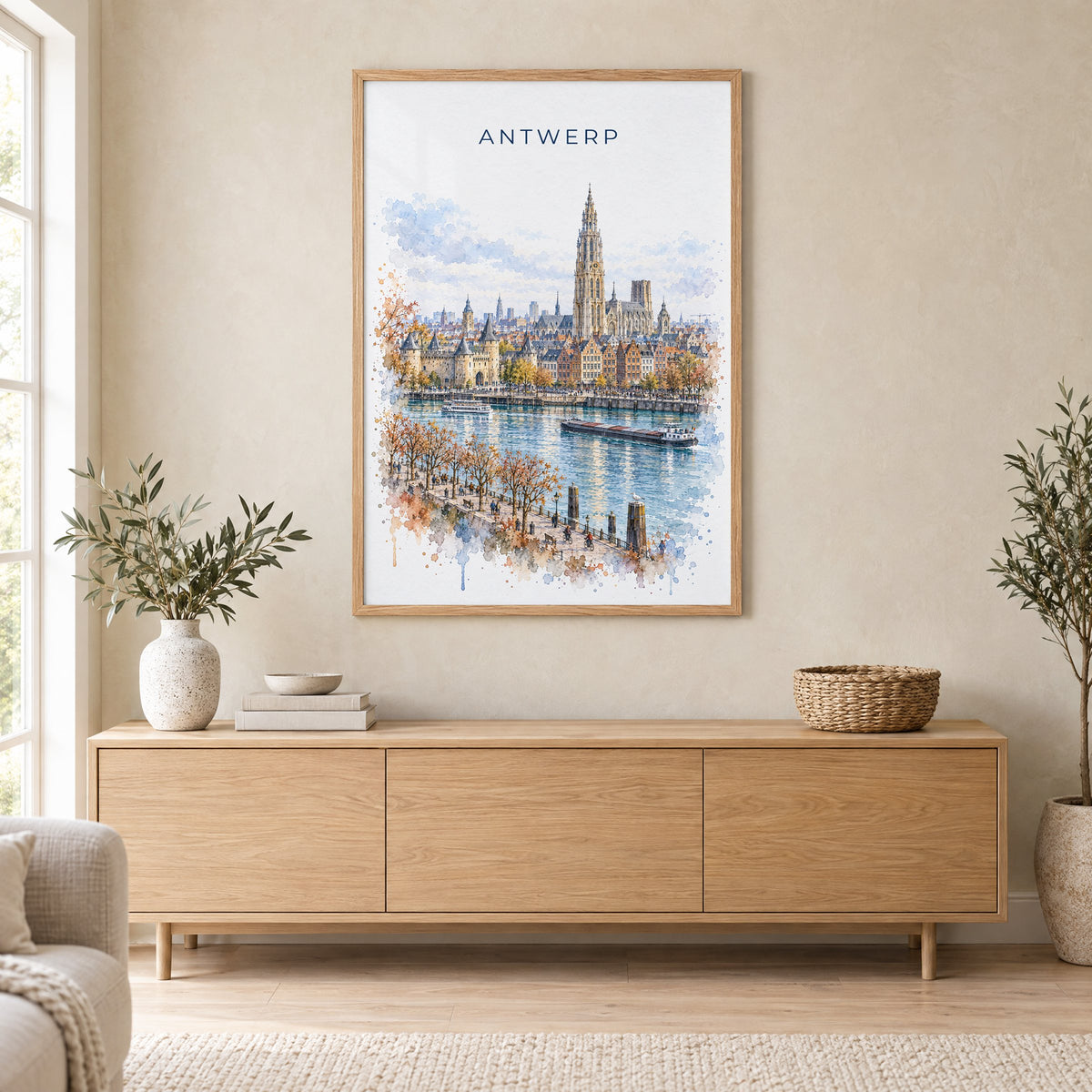 Antwerp watercolor print in an oak frame above a light wood sideboard in a Scandinavian living room