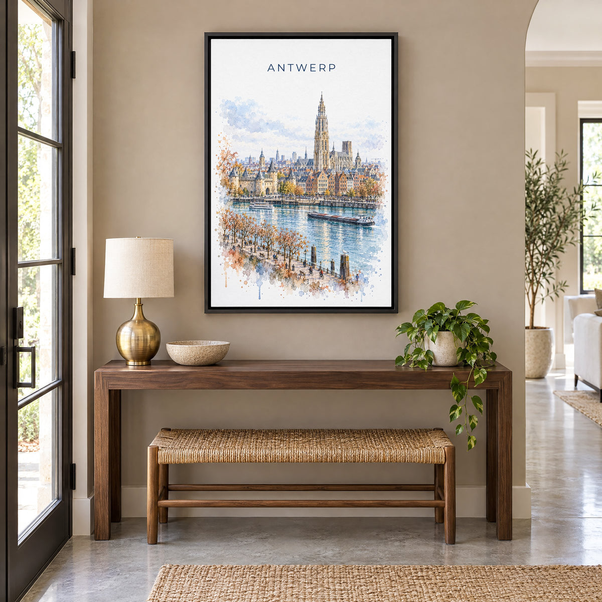 Antwerp watercolor print as a black floater canvas above a walnut console and woven bench in an entryway