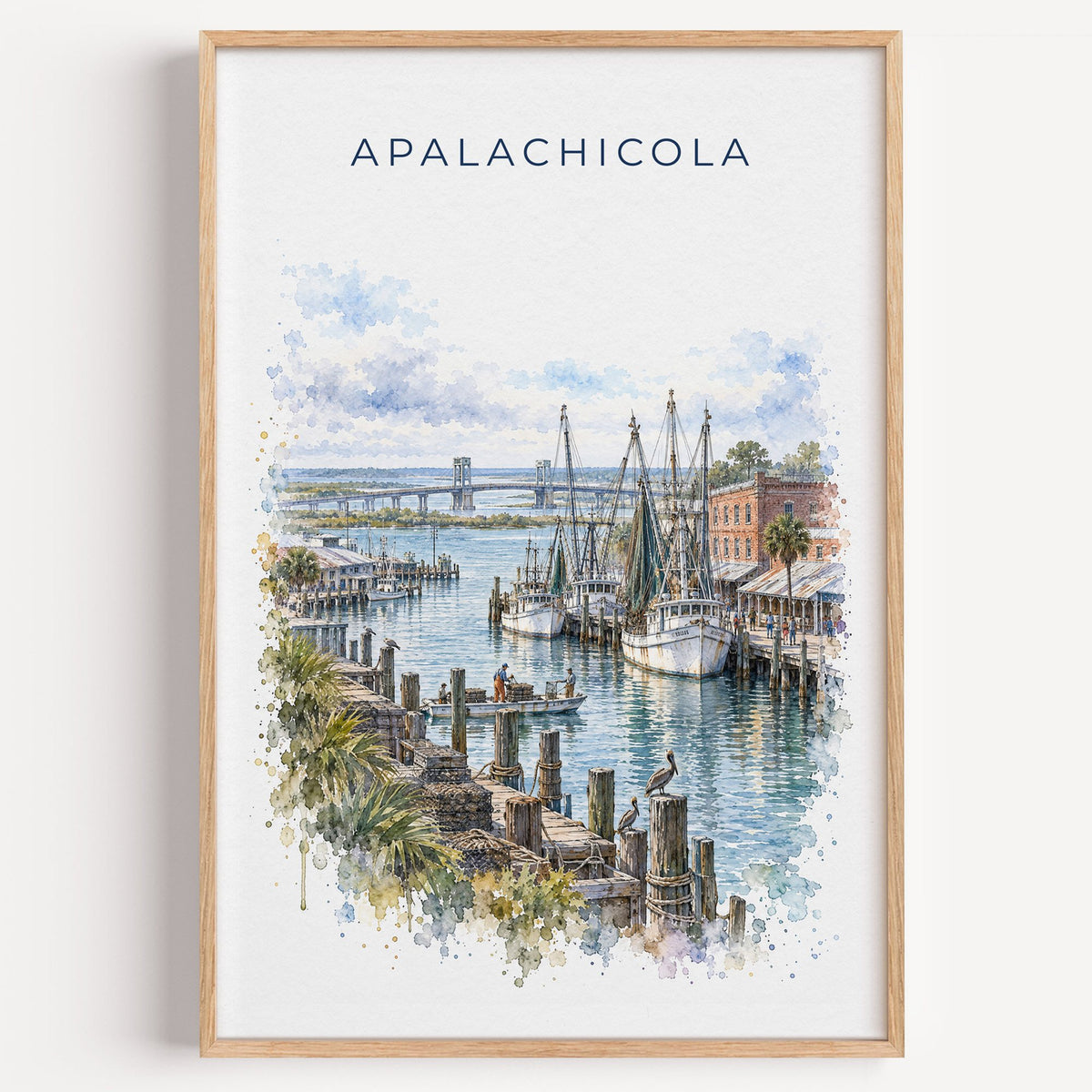 Apalachicola, Florida watercolor print in a light oak frame on a plain white wall