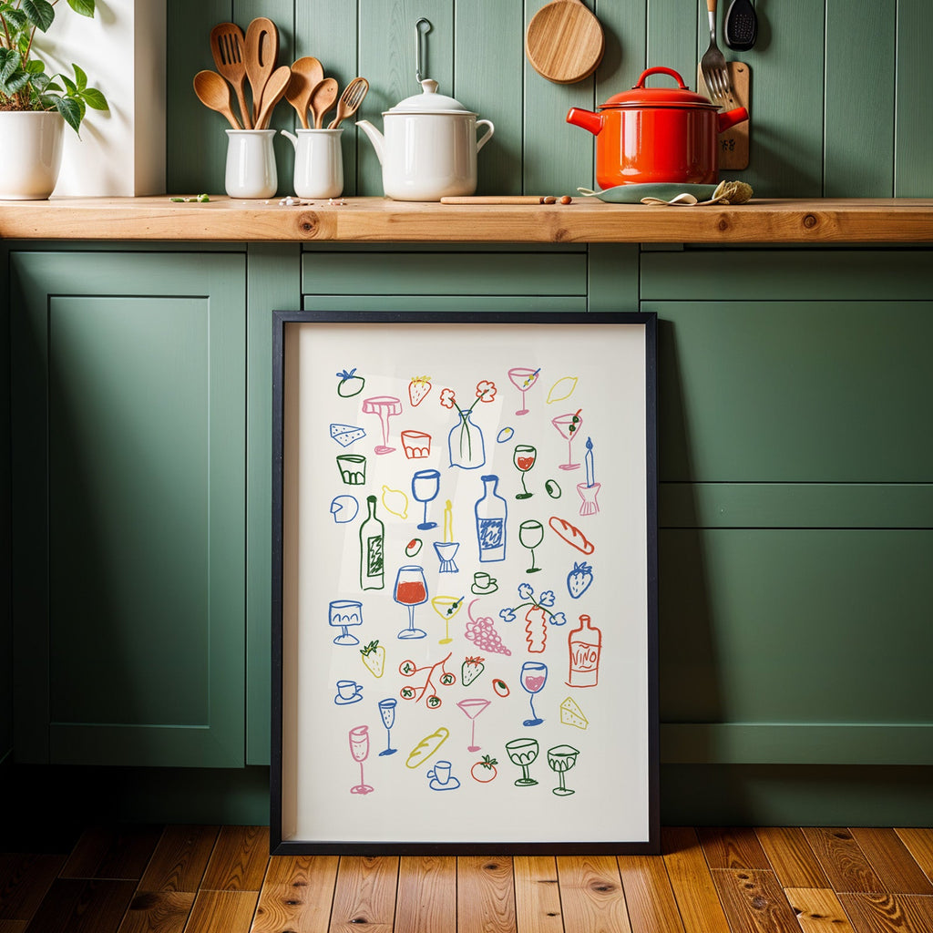 Aperitivo doodle print in a black frame against sage green kitchen cabinets