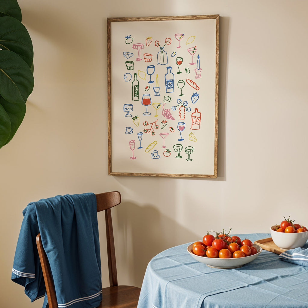 Aperitivo doodle print in an oak frame above a blue linen table with ripe tomatoes