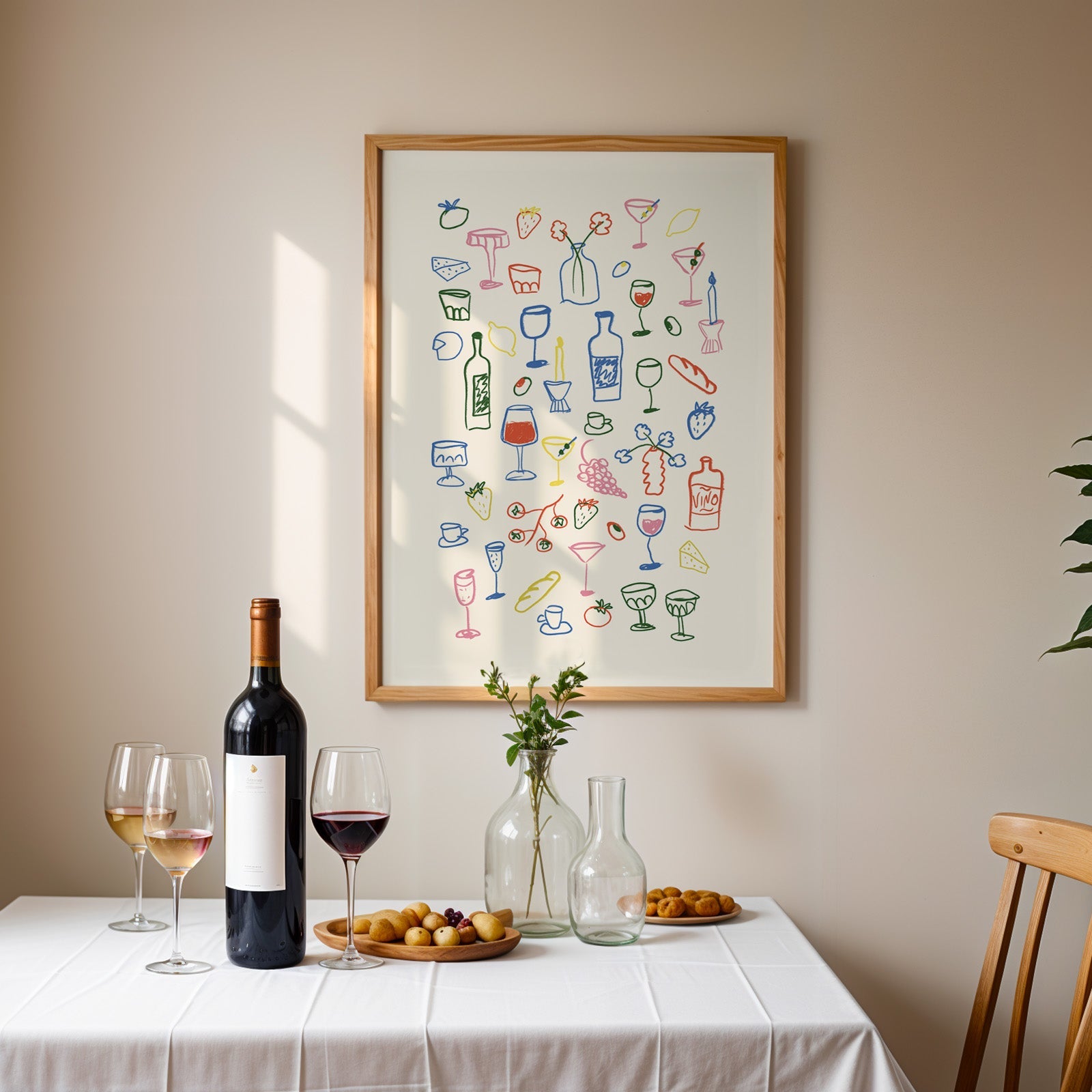 Aperitivo doodle print in an oak frame above a table laid with red wine and glasses
