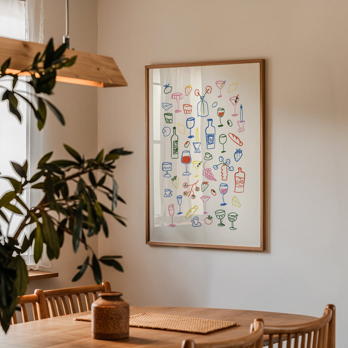 Aperitivo doodle print in a walnut frame above a dining table beside an olive tree