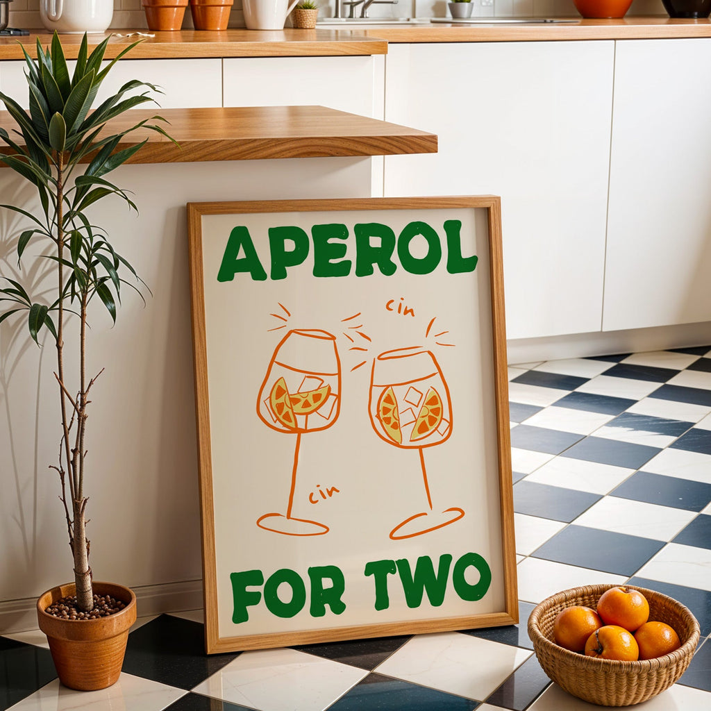 Aperol spritz print in an oak frame by a kitchen island and checkered floor