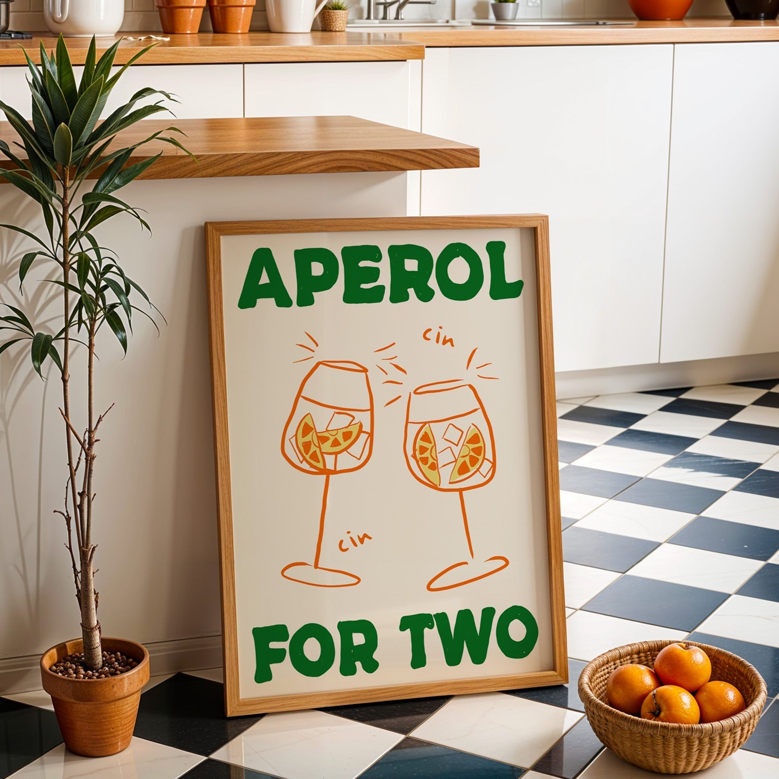 Aperol spritz print in an oak frame by a kitchen island and checkered floor