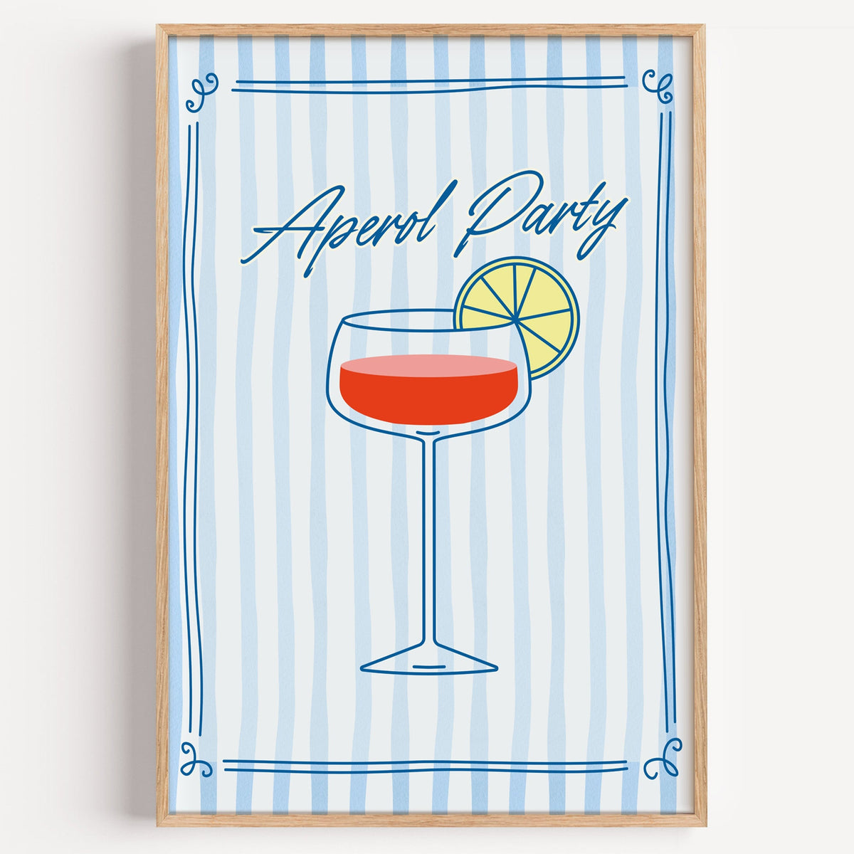 Aperol Party blue stripe print in a light oak frame on a plain white wall