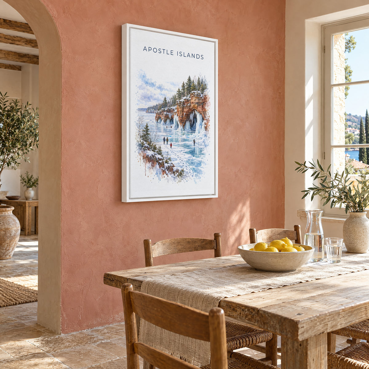 Apostle Islands watercolor print as a white floater canvas on a terracotta wall above a rustic dining table