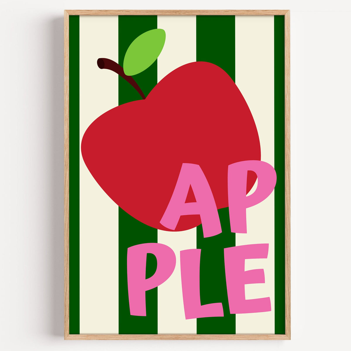 AP PLE red apple stripes print in a light oak frame on a plain white wall
