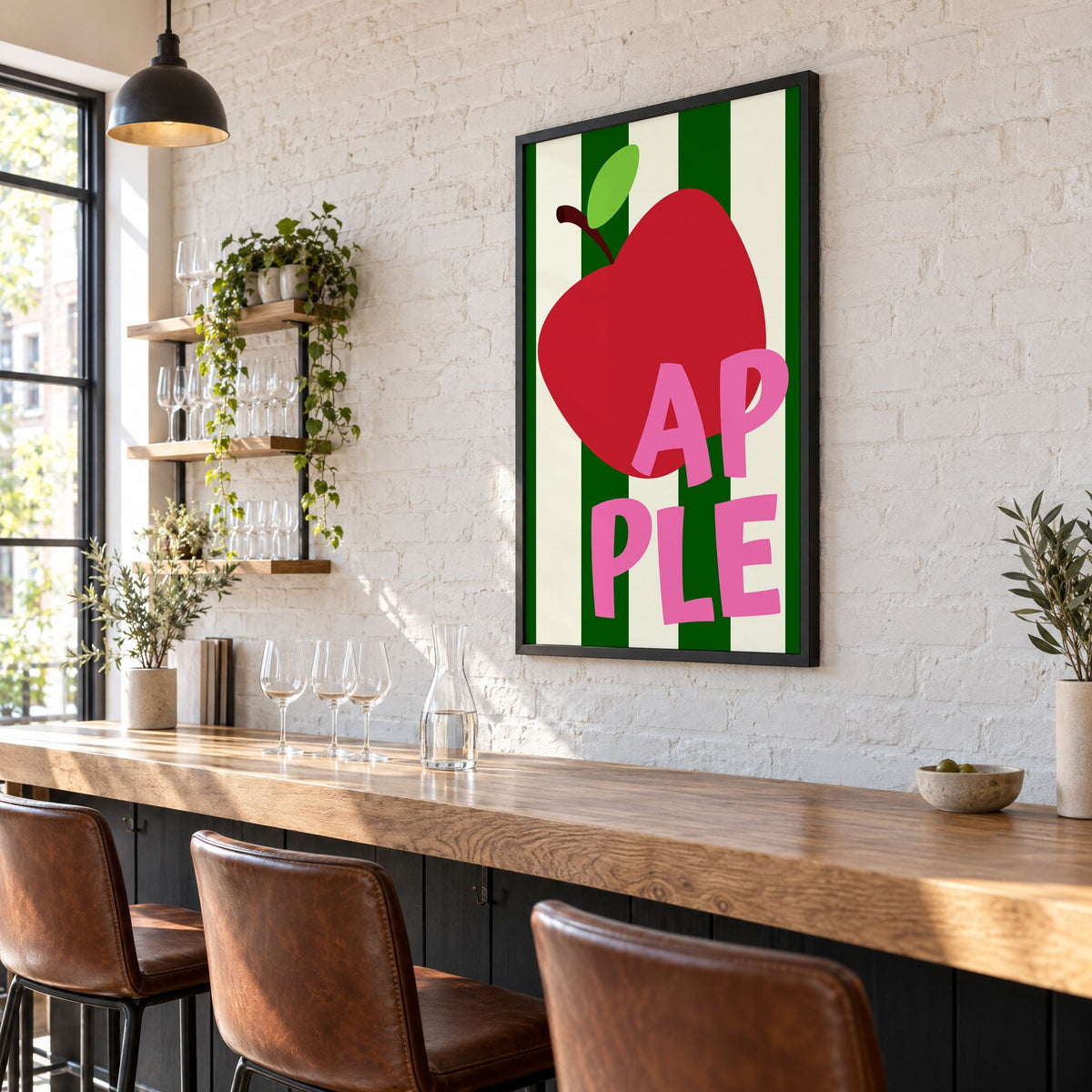 AP PLE red apple stripes print in a black frame on a white brick wall above a wine bar counter