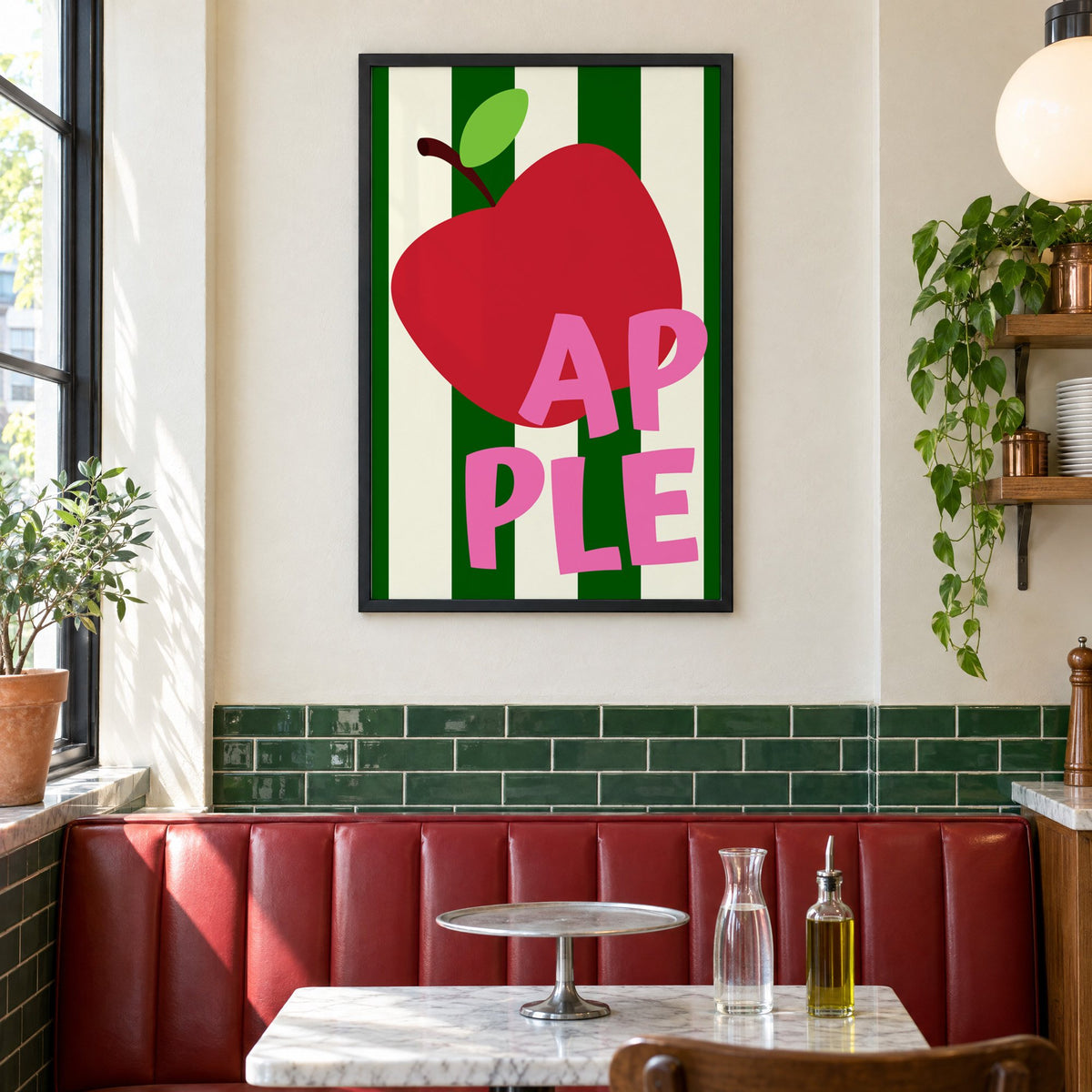 AP PLE red apple stripes print in a black frame above a red leather booth in a sunny pizzeria
